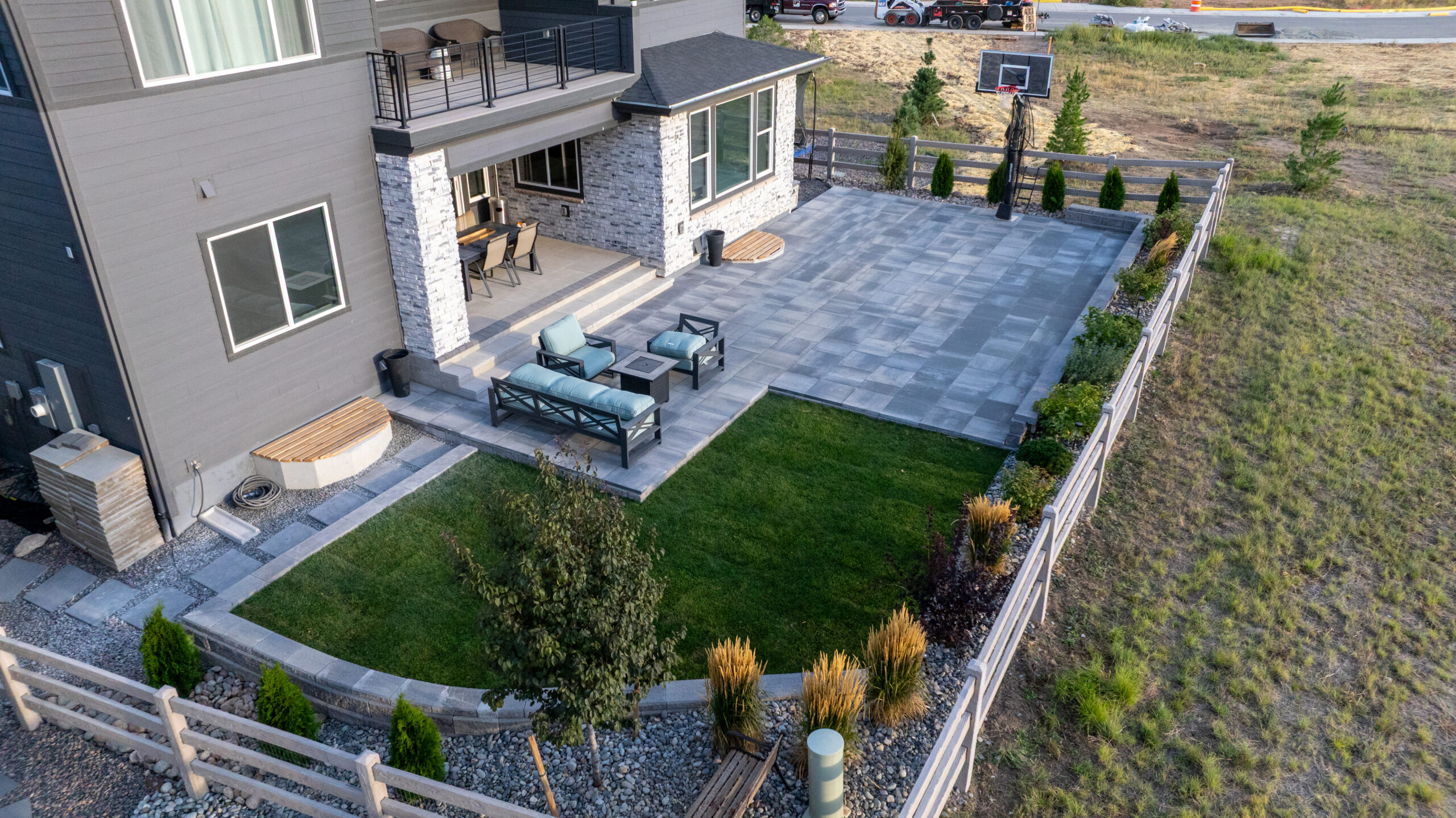 Paver sport coat, retaining wall and sod area