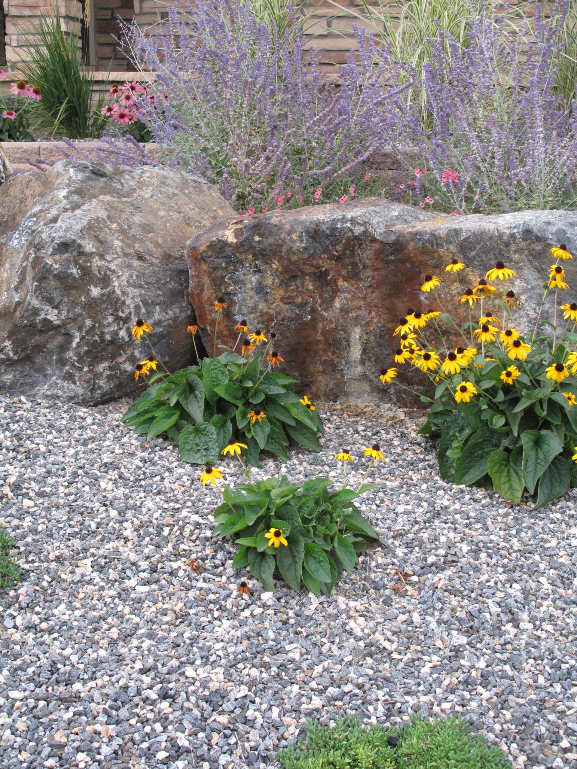 Boulders with ⅜" granite and perennials