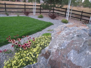 Sod and boulders with planting