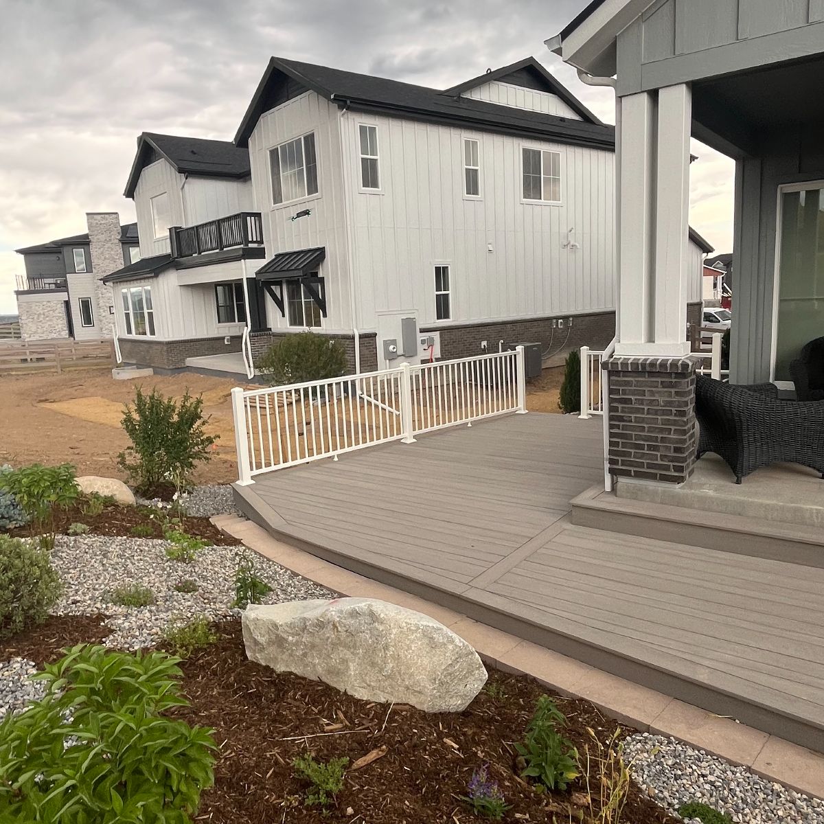 Finished deck and backyard landscape
