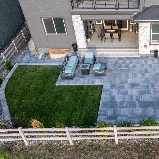 Finished Littleton backyard with retaining wall, pavers and sod — view two