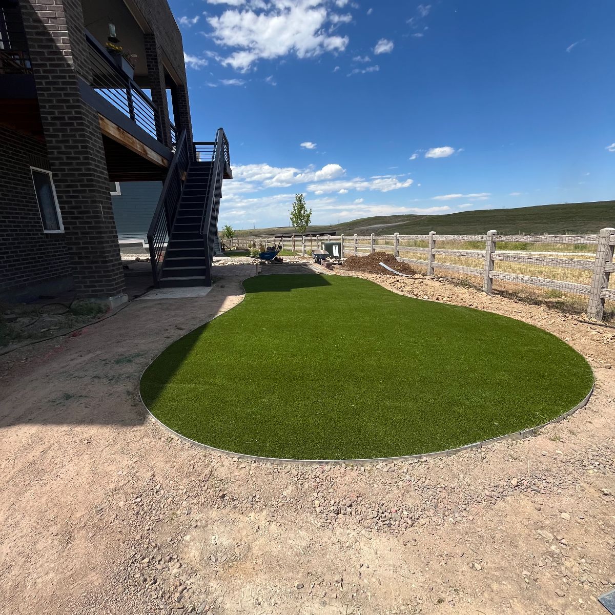 Artificial turf hillside with steel stair in Littleton CO