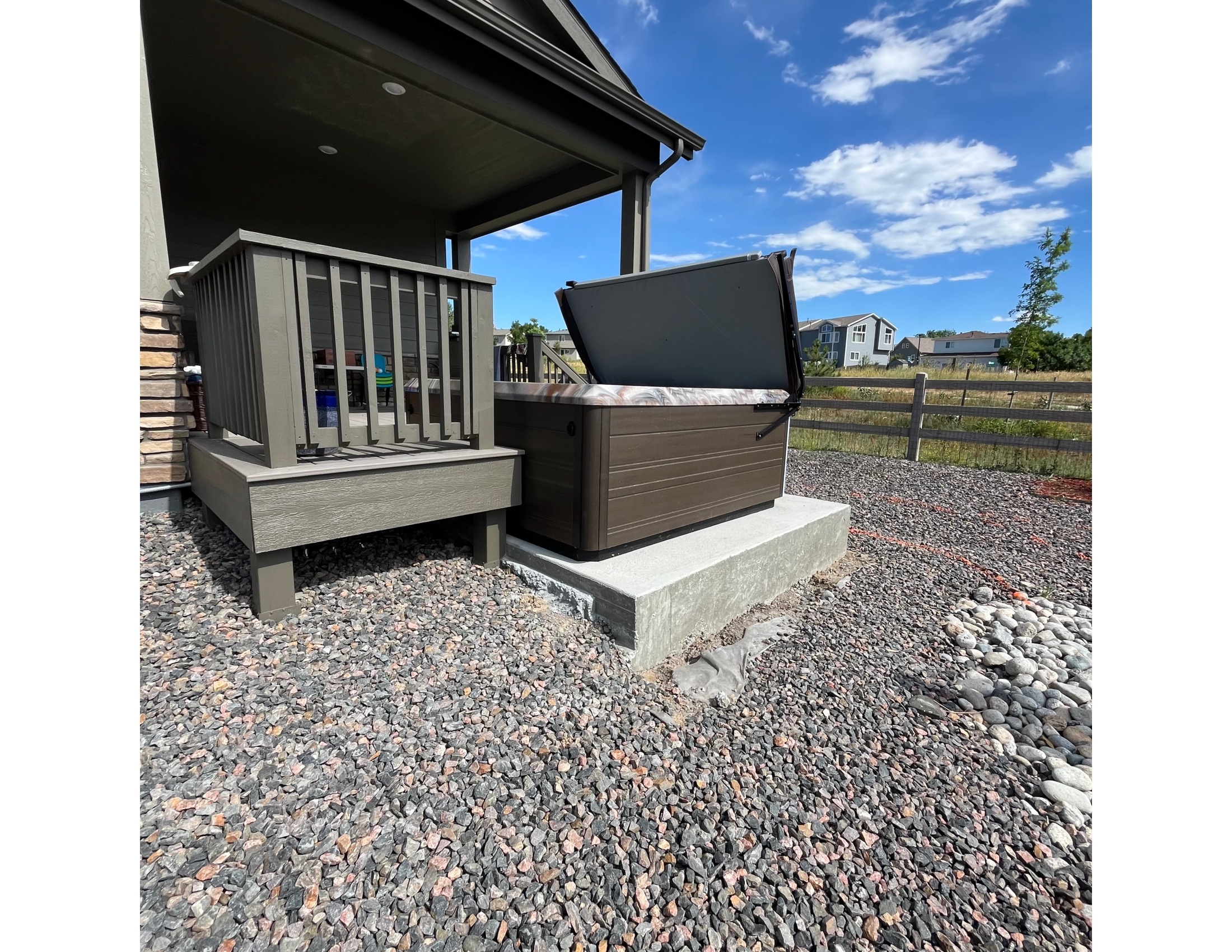 Hot tub pad with river rock drainage in Arvada CO