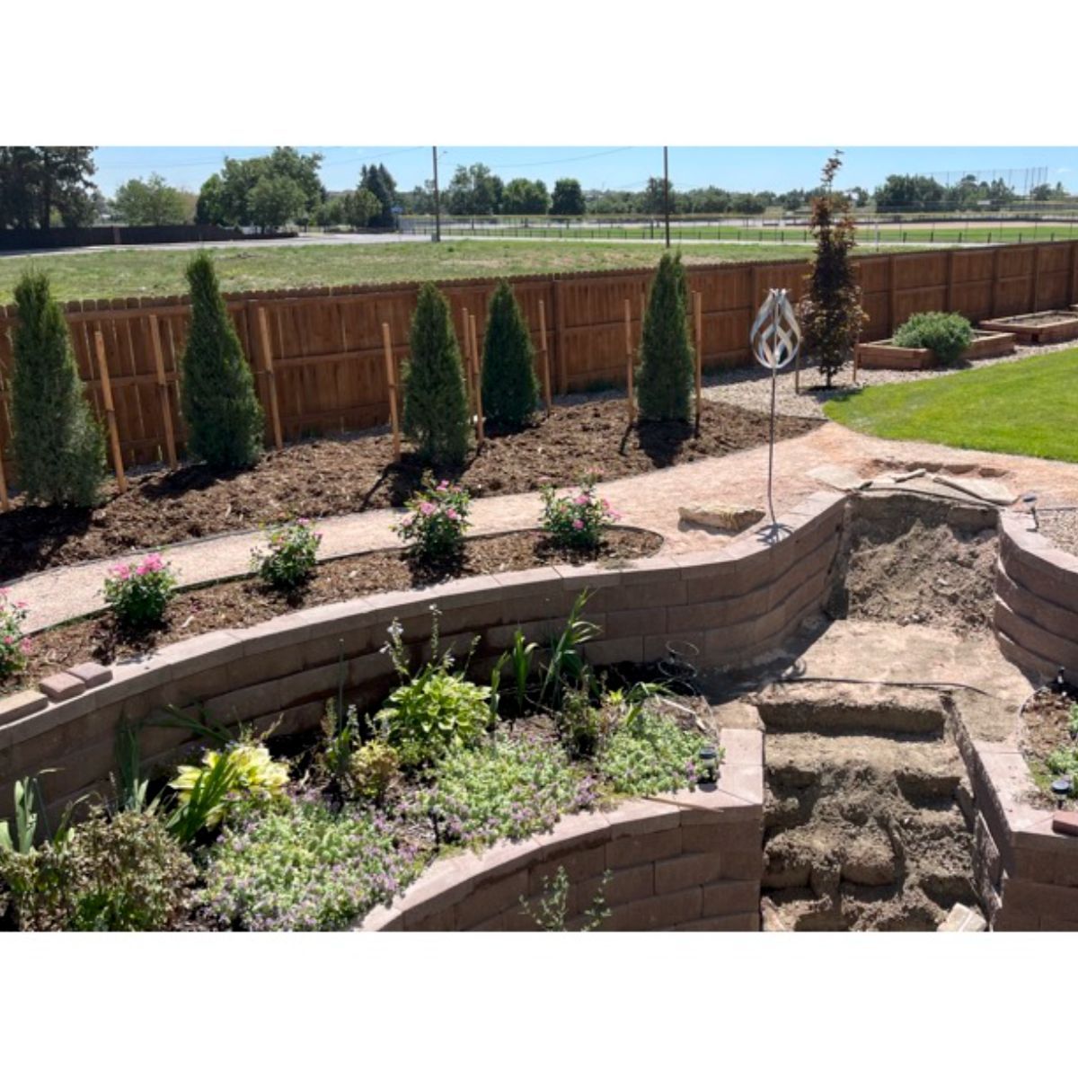 Concrete block retaining wall before — Arvada