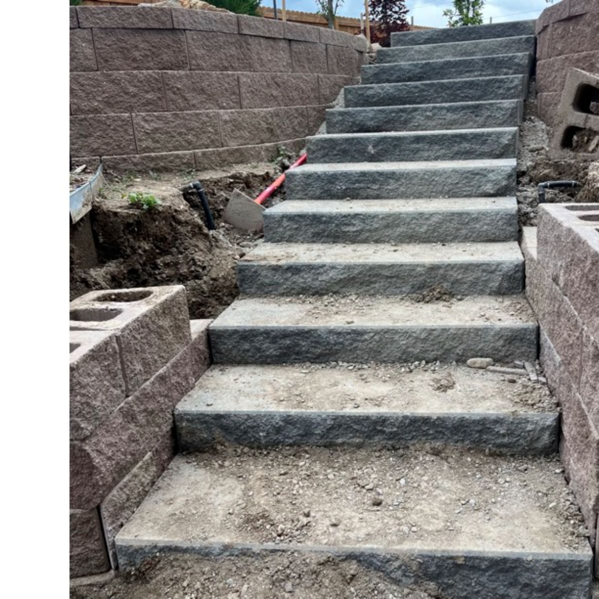 Retaining wall before — Arvada
