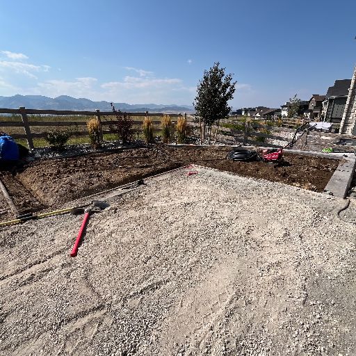 Completed retaining wall with new sod in Littleton CO