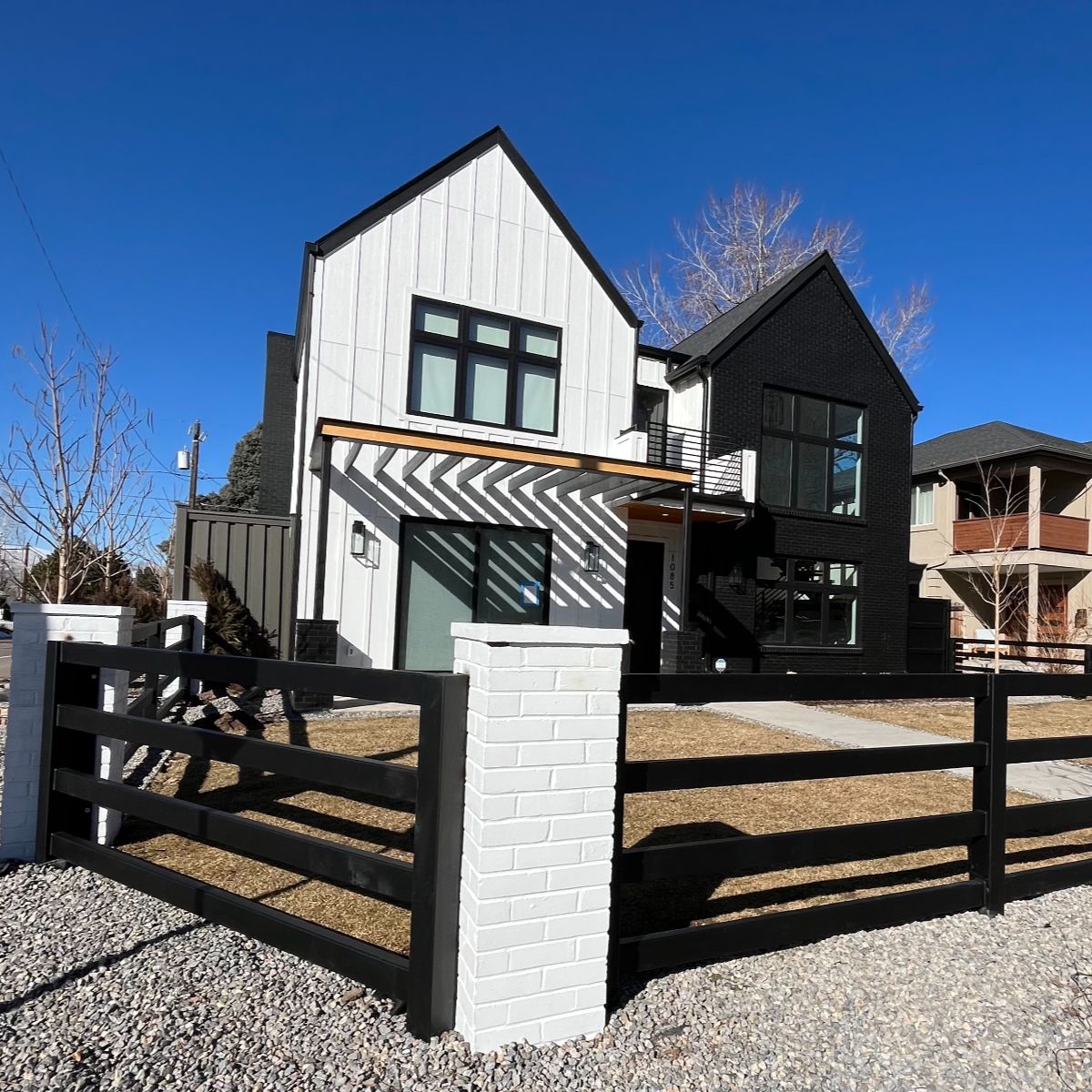 Custom brick columns and steel fence masonry in Denver