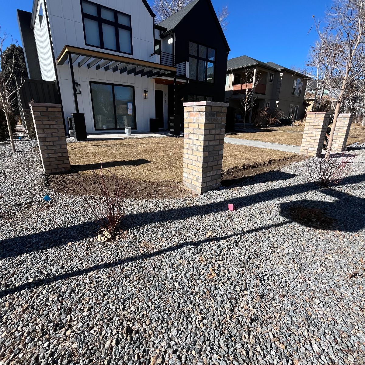Brick columns and steel fence under construction in Denver CO