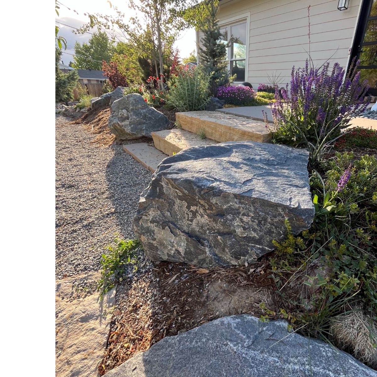 Stone steps with boulders and raised plantings in Denver CO
