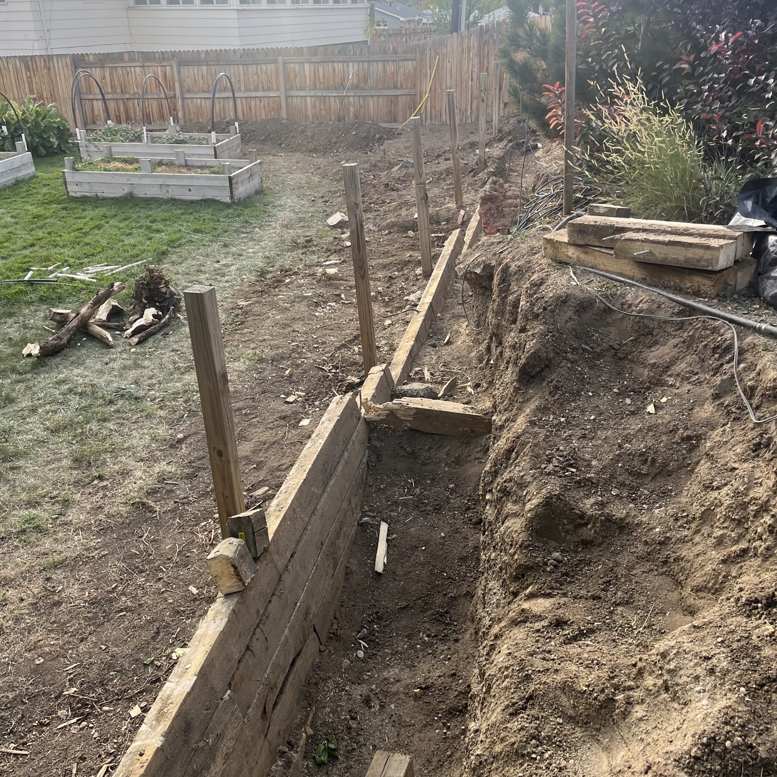 Failing timber retaining wall before replacement in Arvada CO
