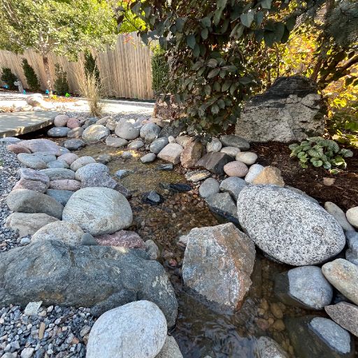 Custom backyard water feature installed in Arvada, Colorado by Colorado Native Landscapes